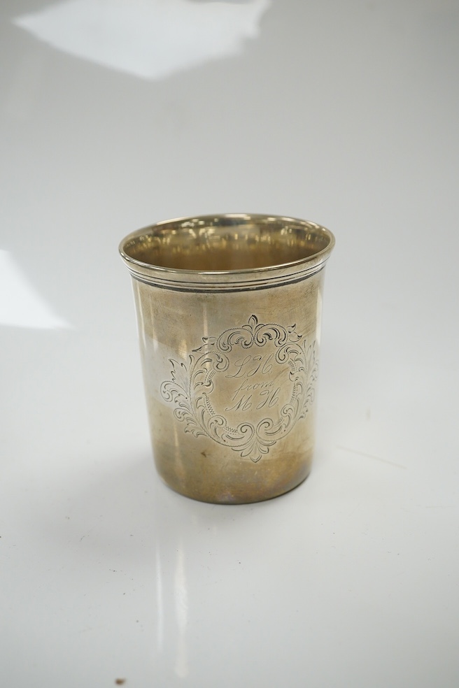 An Austrian 800 standard white metal matchbox holder, a 19th century continental white metal beaker, a modern silver mounted box cover and a silver vesta case. Condition - poor to fair